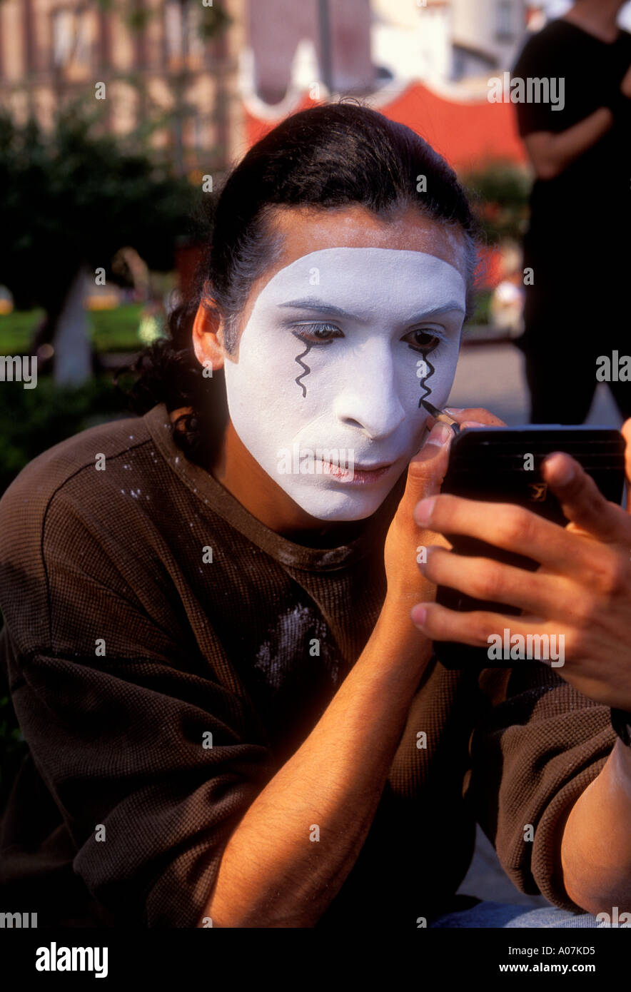 1, one, Mexican man, young adult man, mime, face painting, applying make-up, Plaza Hidalgo, Coyoacan, Mexico City, Federal District, Mexico Stock Photo