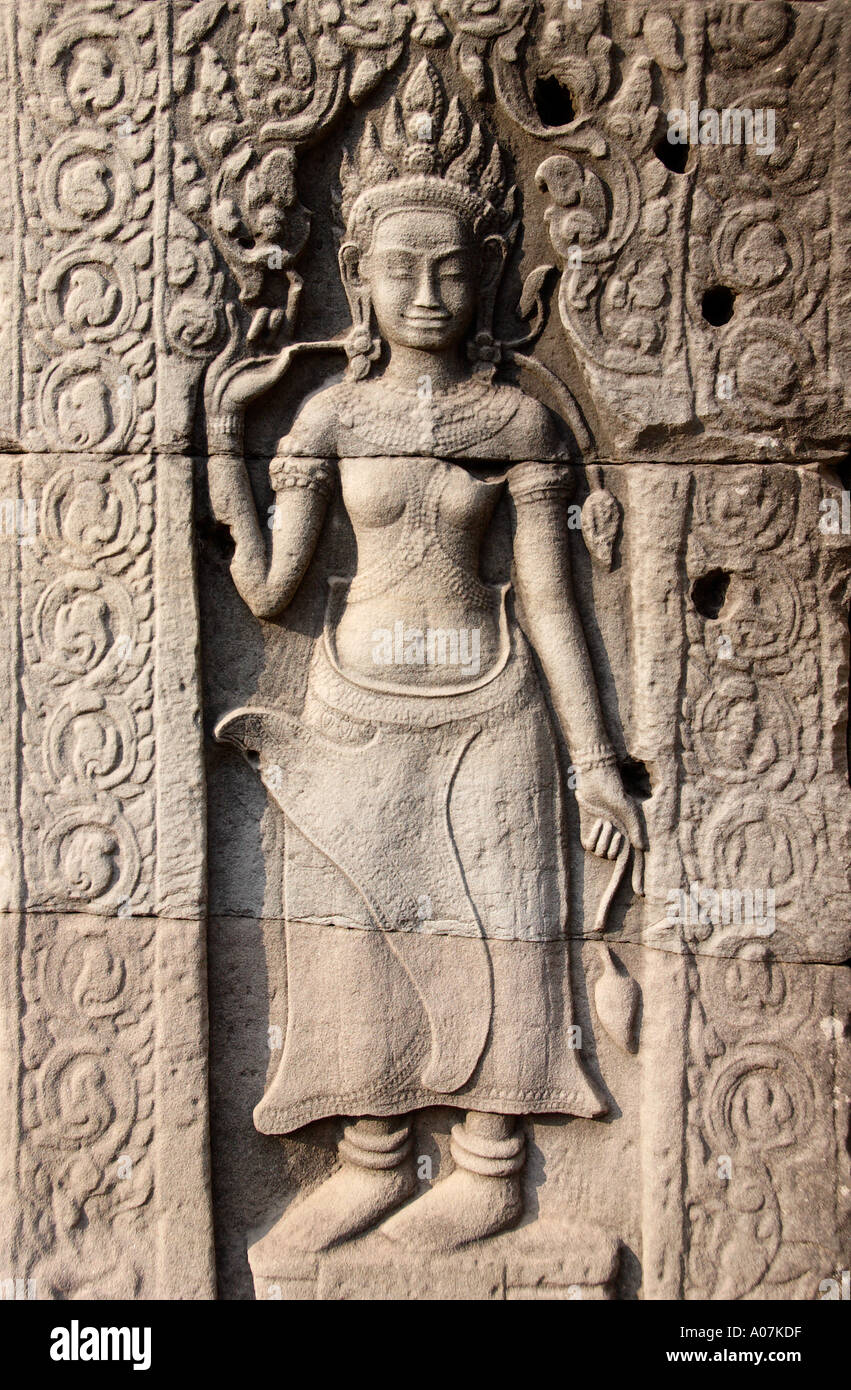 Lady with two lotus flowers Bayon Temple Stock Photo