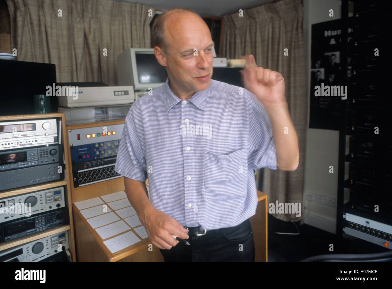 Musician and music Producer Brian Eno in the studio during the recording of the Help album for the Warchild Charity Stock Photo