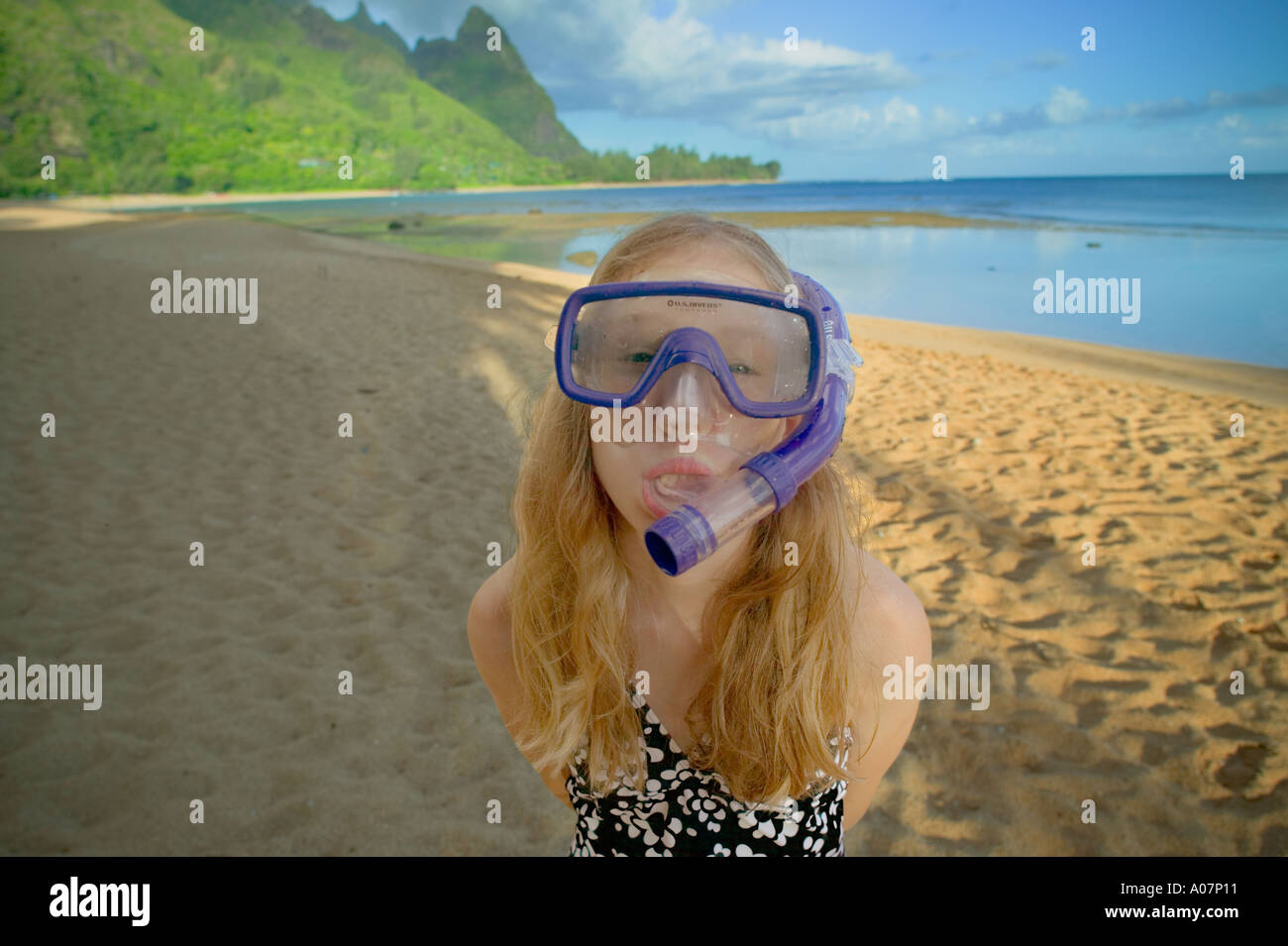 Portrait of girl with snorkel and mask on Tunnels Beach Kauai Hawaii
