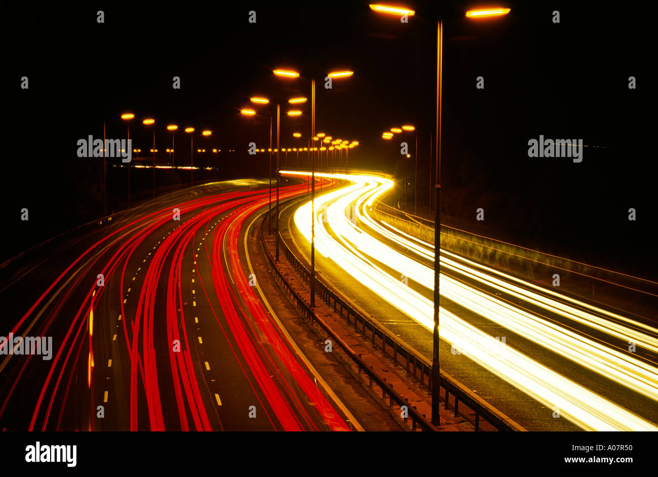 Lights of traffic on the M1 Motorway at night Northamptonshire Stock