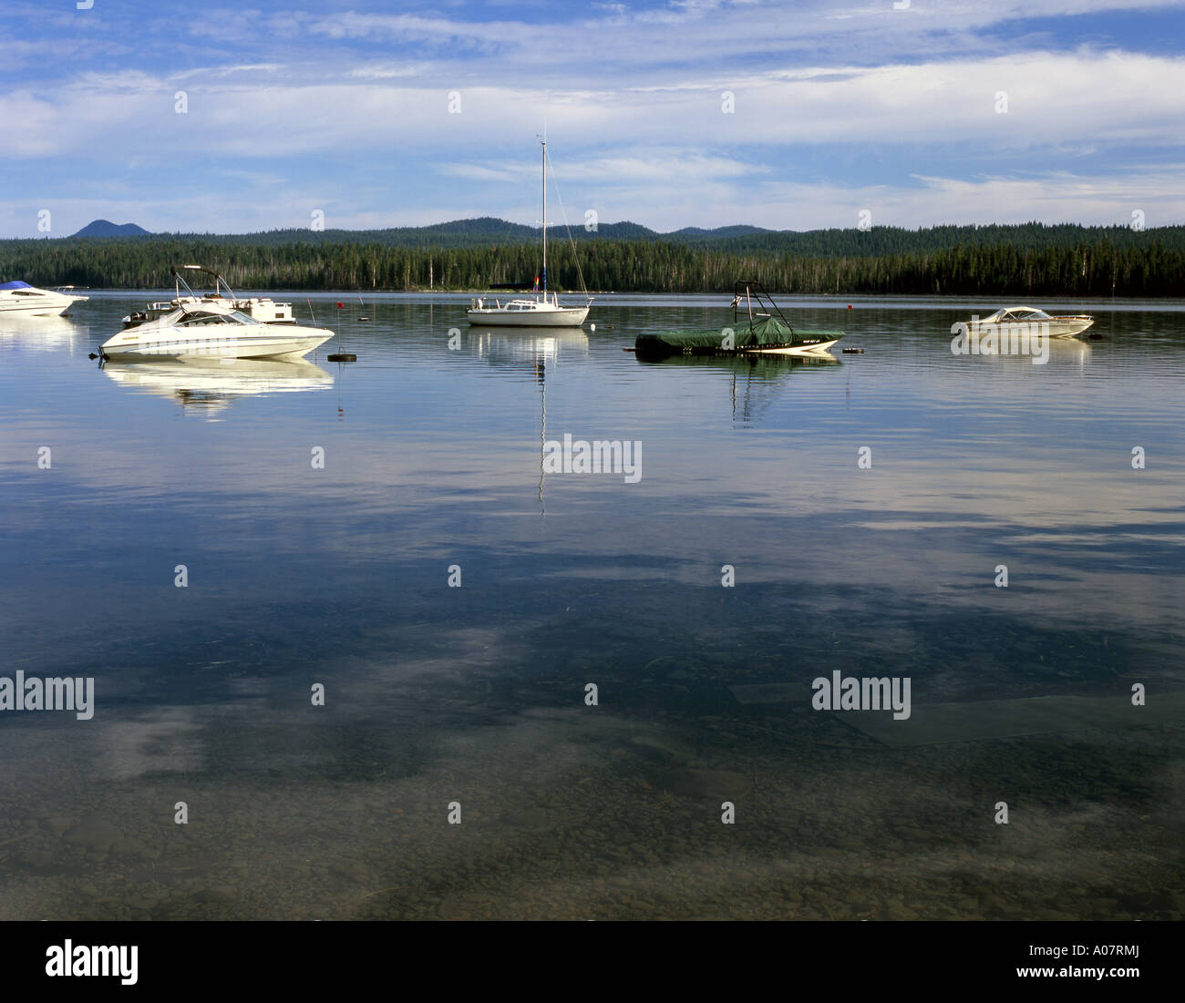 Boats reflect into Central Oregon's Cultus Lake Stock Photo Alamy