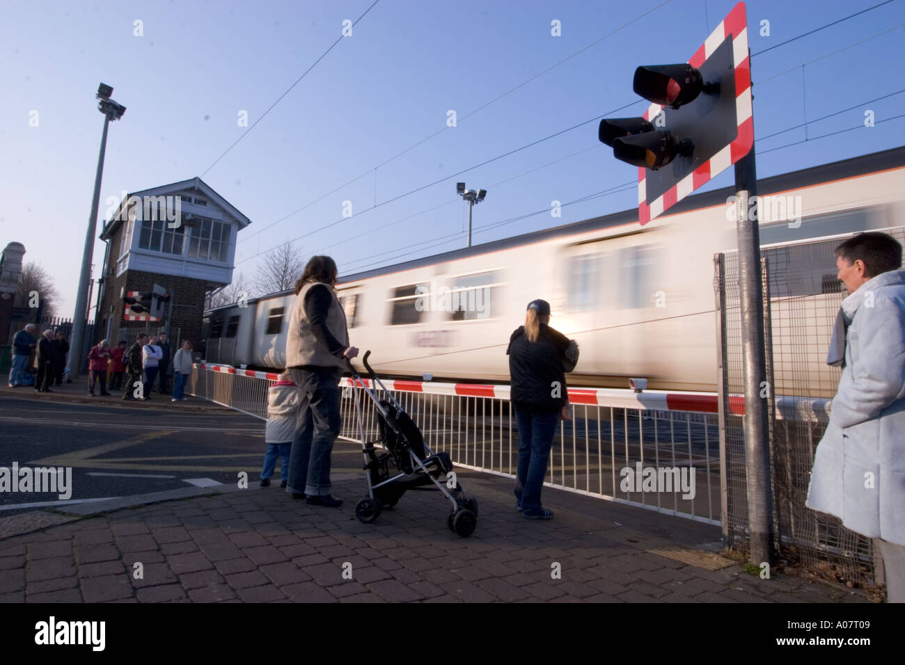 Level crossing barrier and listed signal box Highams Park London with