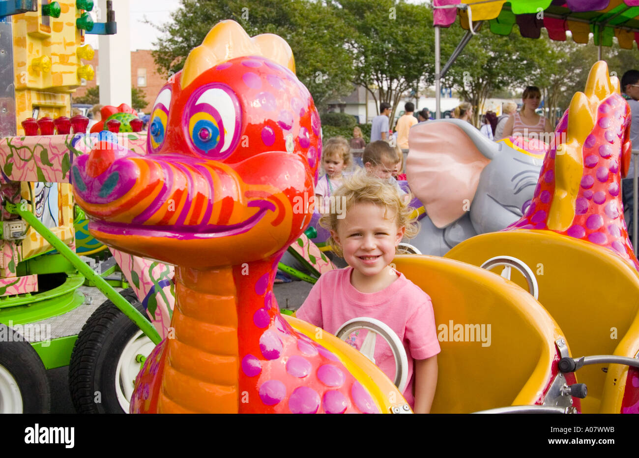 Child on carnival ride Stock Photo - Alamy