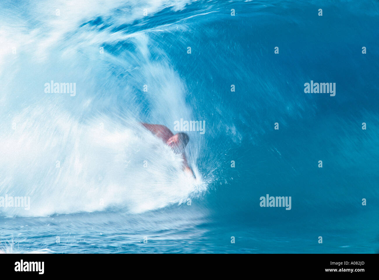 A bodysurfer riding a wave in Hawaii Hawaii USA UNITED STATES Stock Photo