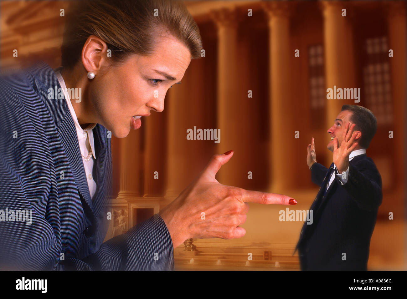 Businesswoman pointing at businessman Stock Photo