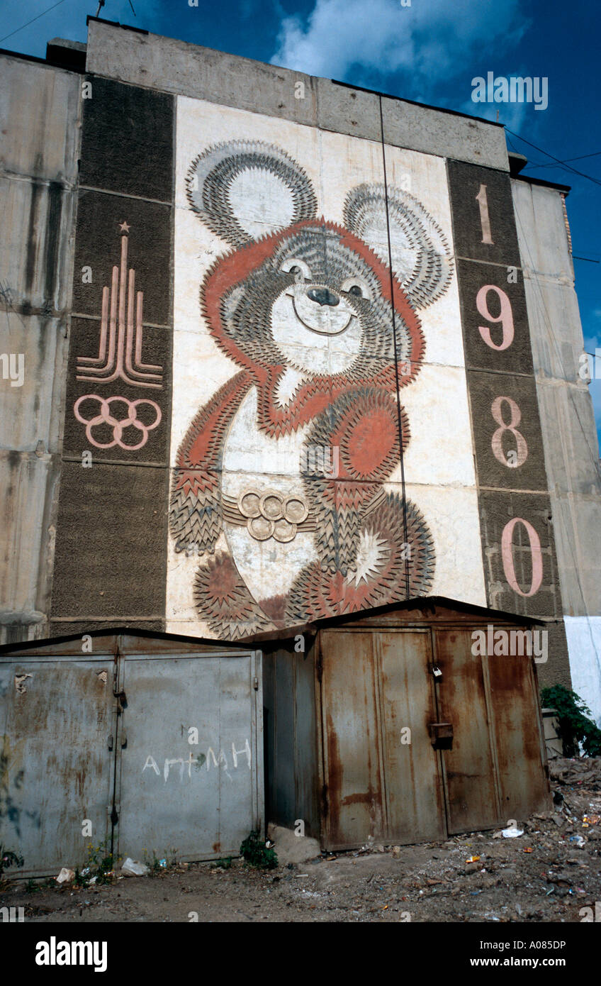 Olympic mascot Misha (1980) on an apartment block in the Kyrgyz city of Osh. Russian legacy in the former states of the Soviet Union. Stock Photo