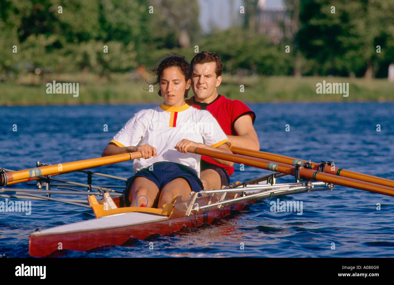 Mixed double man women rowing sculling crew training on the Charles River,  Boston, Massachusetts, USA Stock Photo - Alamy
