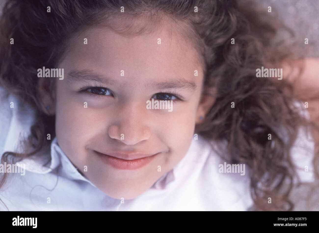 Young Girl smiling at camera Stock Photo - Alamy