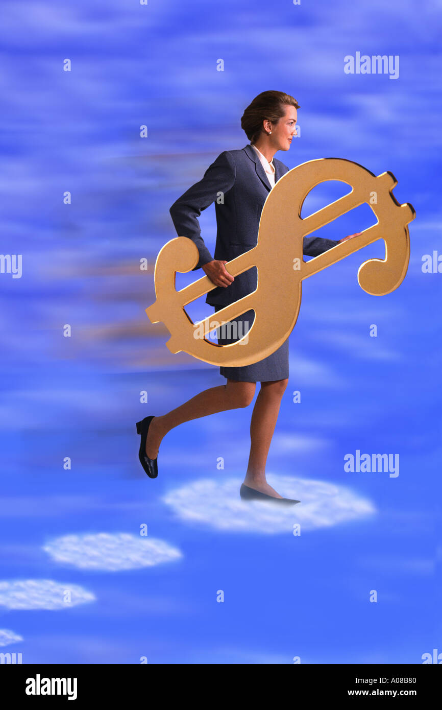 Businesswoman holding golden dollar sign Stock Photo