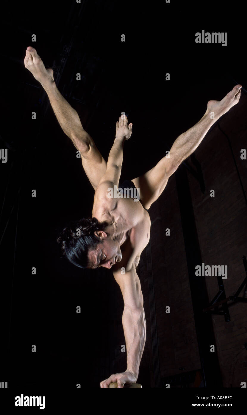 acrobat balancing on one hand Stock Photo - Alamy