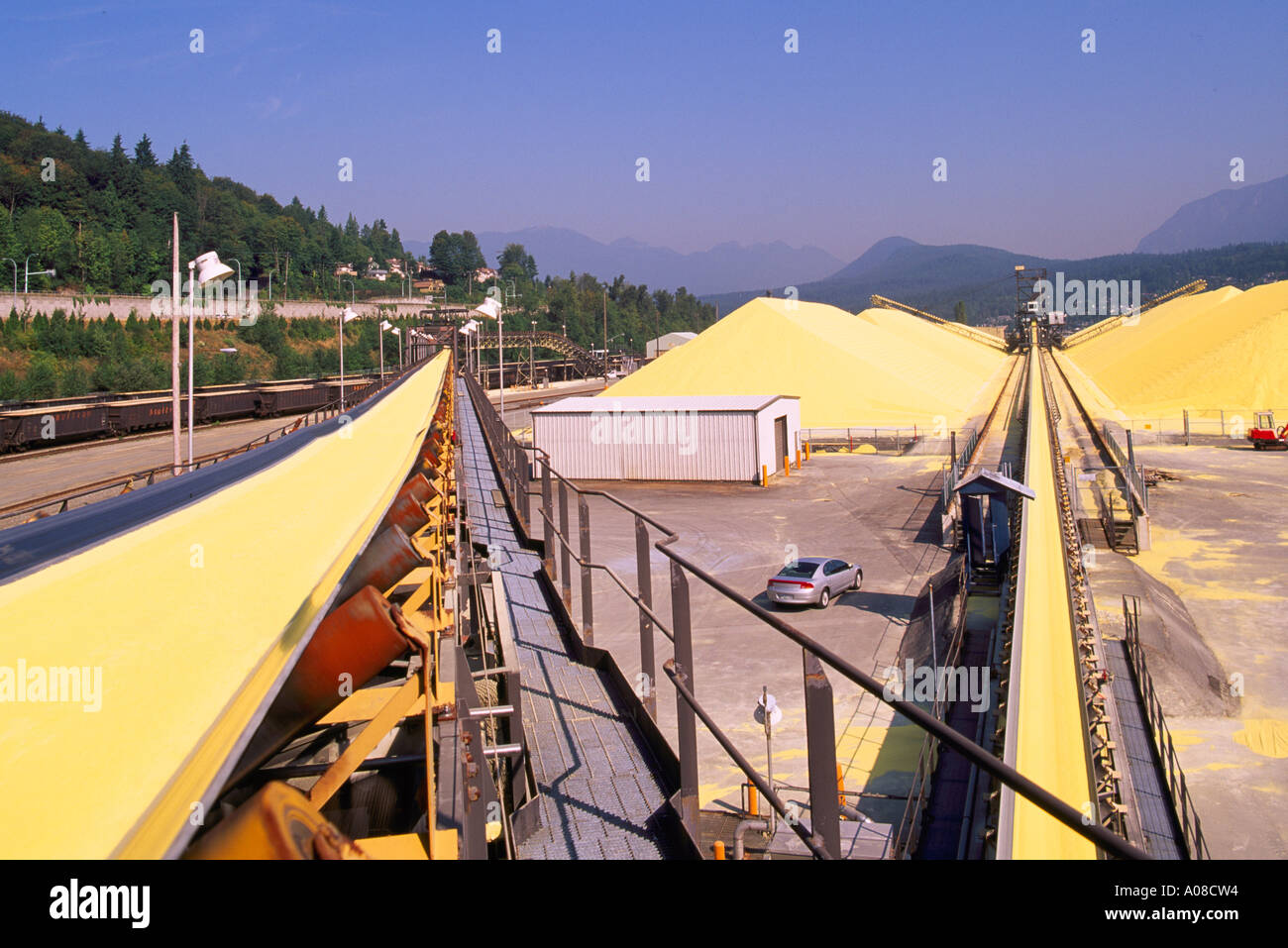 Port Moody, Port of Vancouver, BC, British Columbia, Canada - Sulphur Pile Storage at Shipping Terminal Facility, Industry Stock Photo