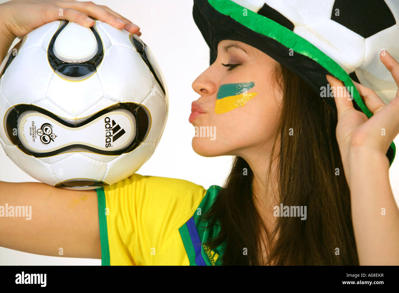 Frau mit Fussball und Brasilien Trickot, woman with football and Brazilian football shirt football fan Stock Photo