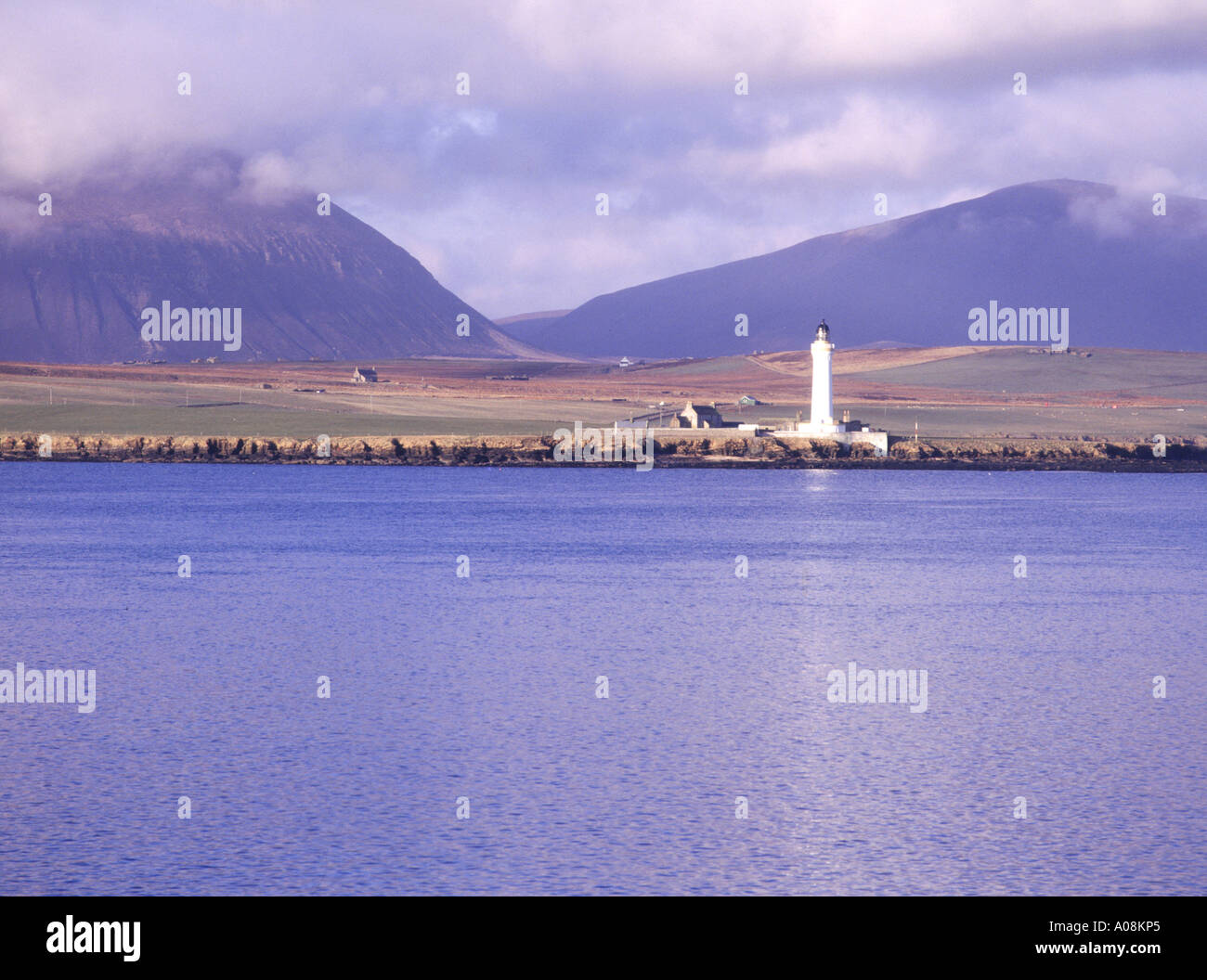 dh  SCAPA FLOW ORKNEY Graemsay Lighthouse and island Hoy hills Hoy Stock Photo