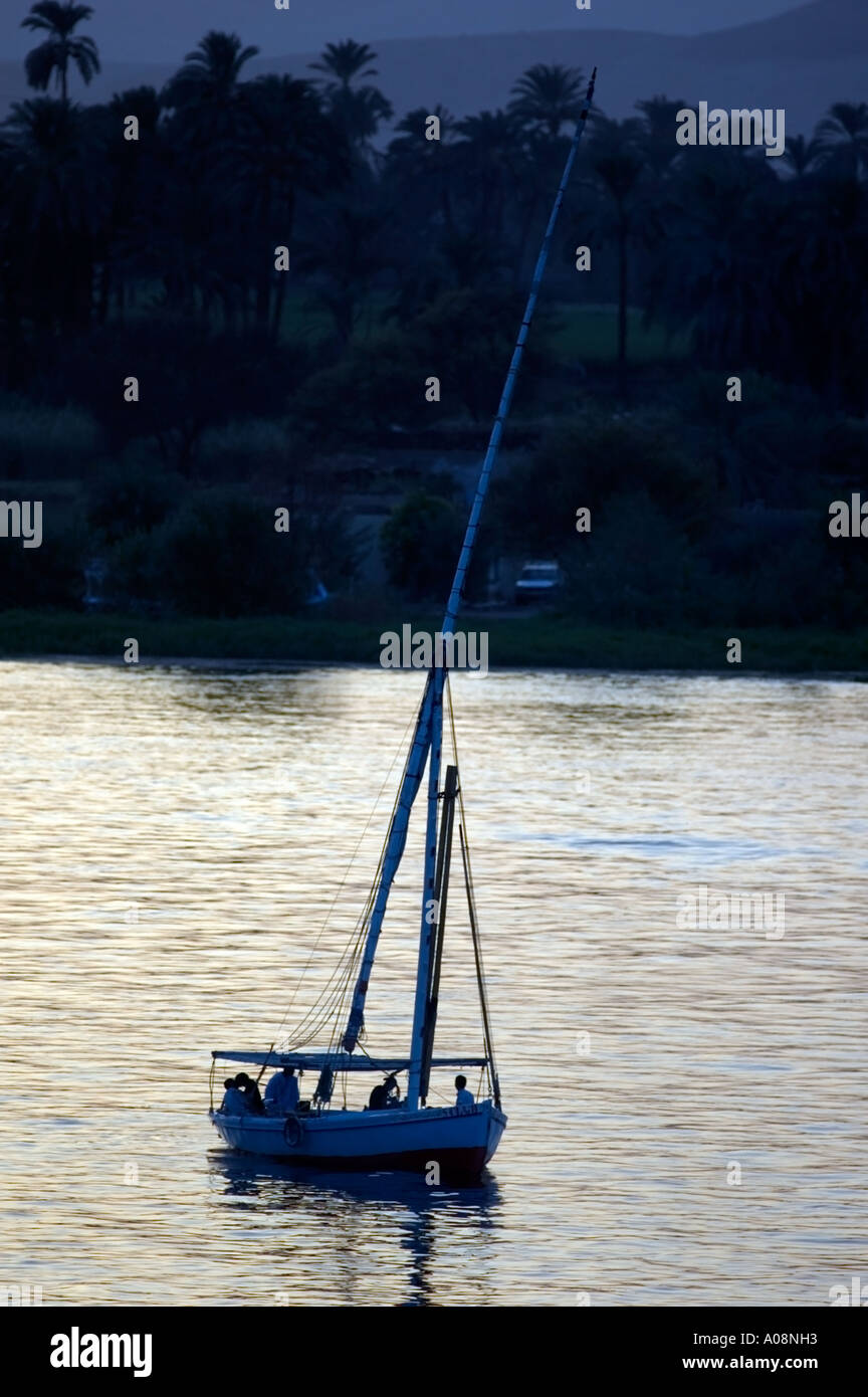 A felucca, the traditional Nile boat on the Nile river at sunset, Luxor ...