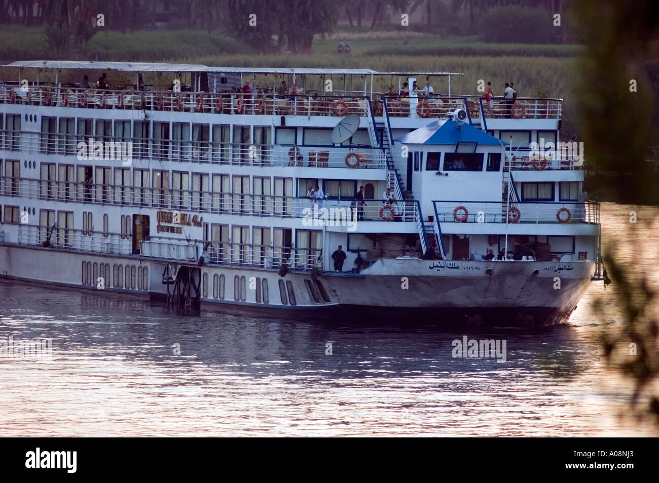 Tourist boat on the Nile river at sunset, Luxor, Egypt Stock Photo - Alamy