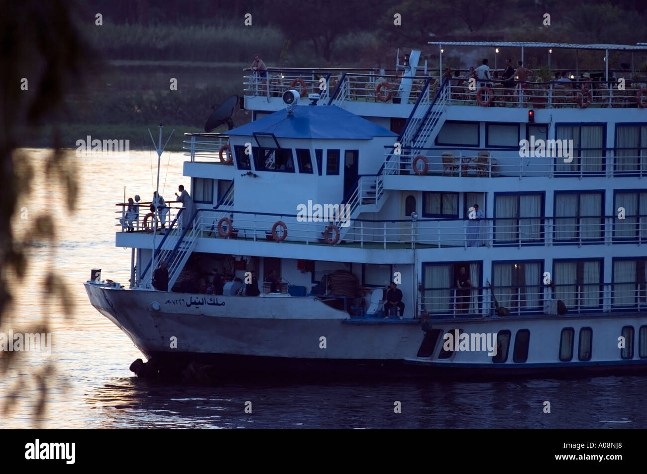 Tourist boat on the Nile river at sunset, Luxor, Egypt Stock Photo - Alamy