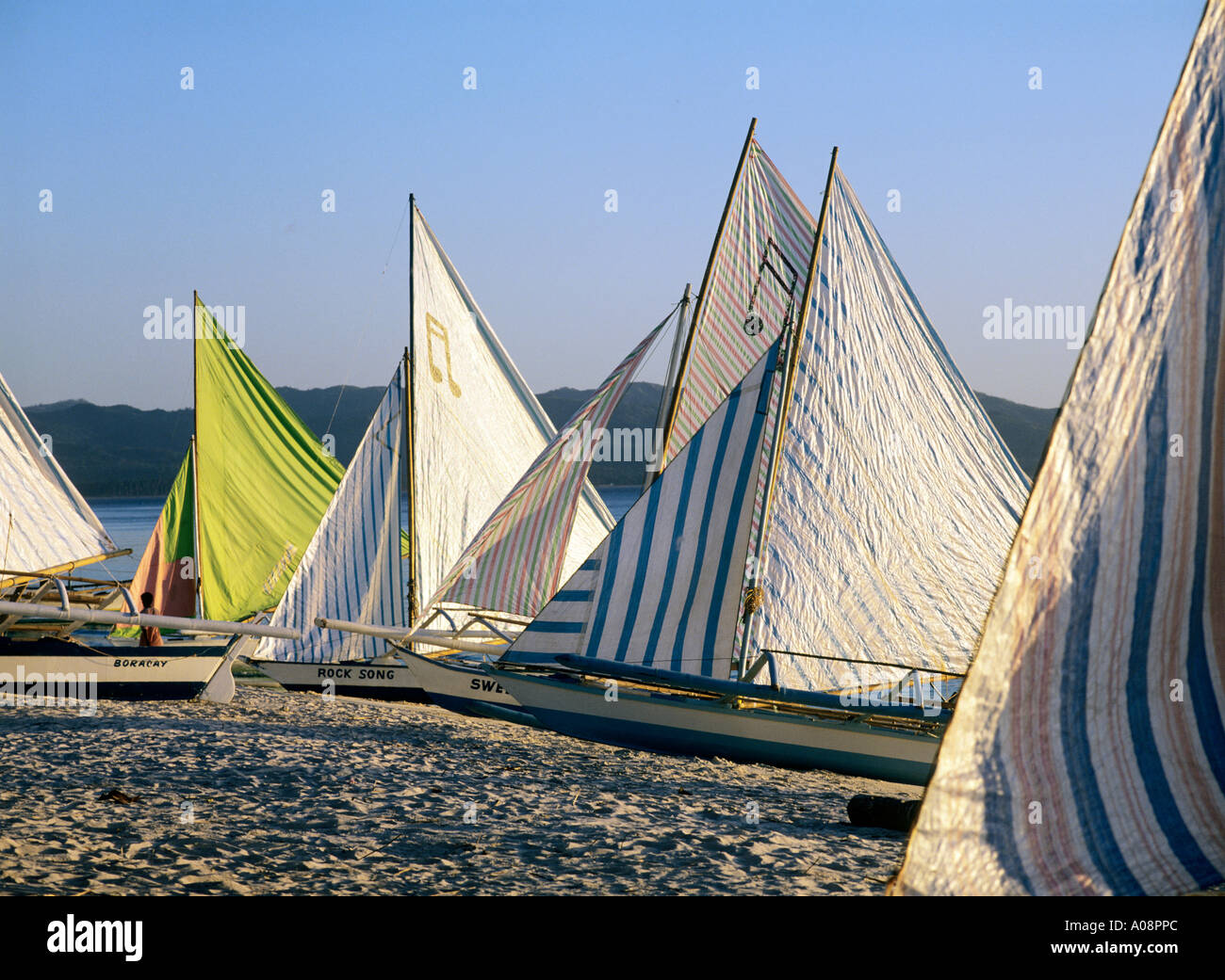 Yachts pulled up on the beach in Boracay, Philippines Stock Photo