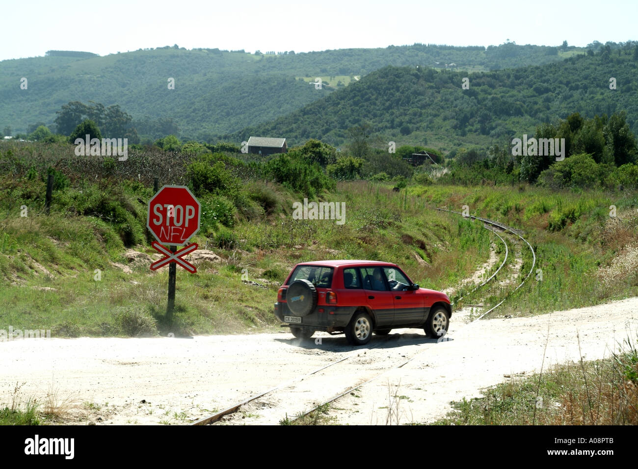 Unmanned railway crossing with stop sign at Wilderness Western Cape South Africa RSA Stock Photo