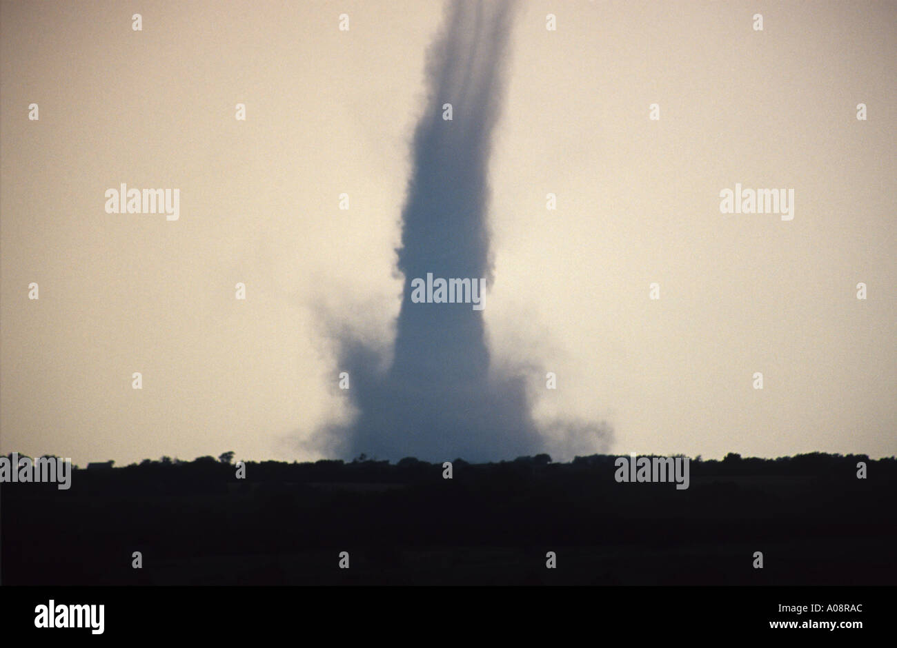 A dusty tornado grinds over farmland in Nebraska USA 2004 Stock Photo