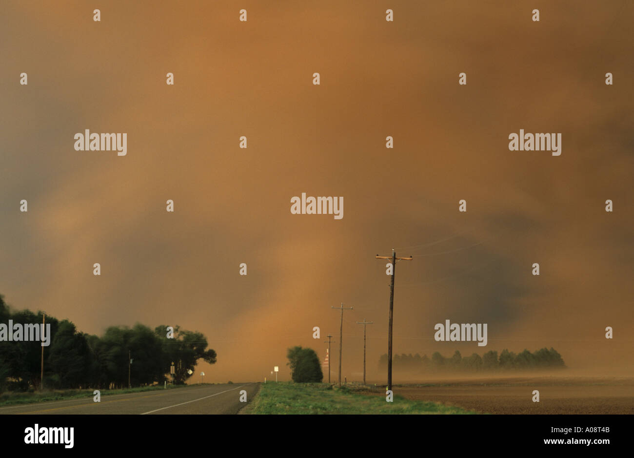 A rotating wall cloud under a supercell thunderstorm sucks up red soil ...