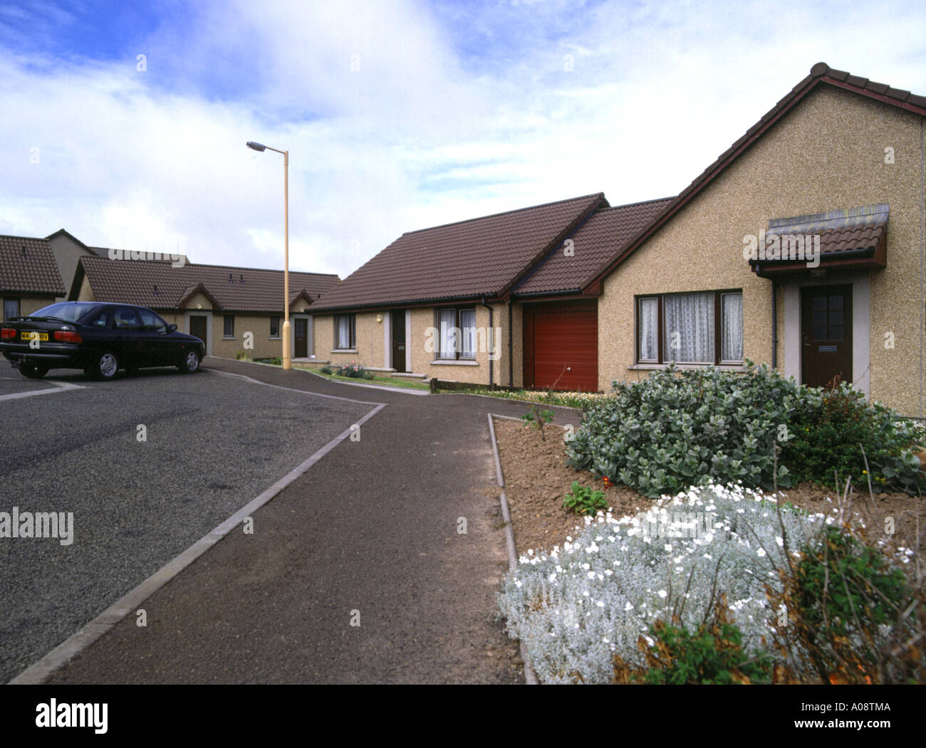 dh Weyland houses KIRKWALL ORKNEY Car street bungalow houses and road
