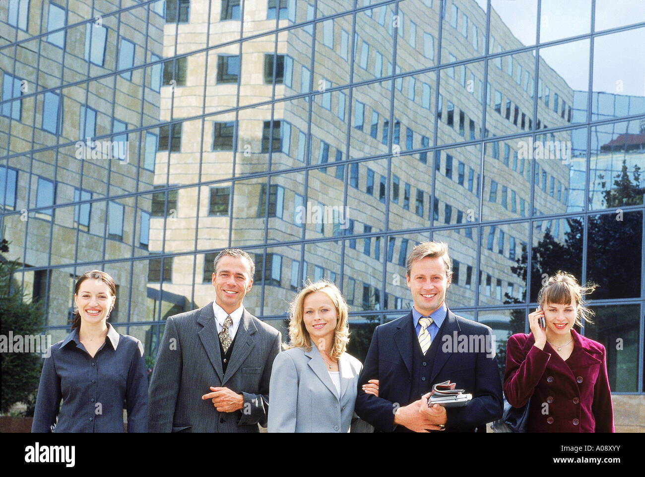 Portrait of business executives standing together outdoors Stock Photo ...