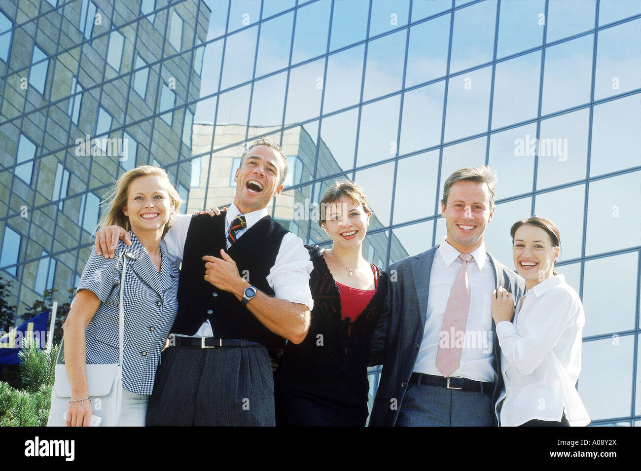 Portrait of young business executives standing together Stock Photo - Alamy