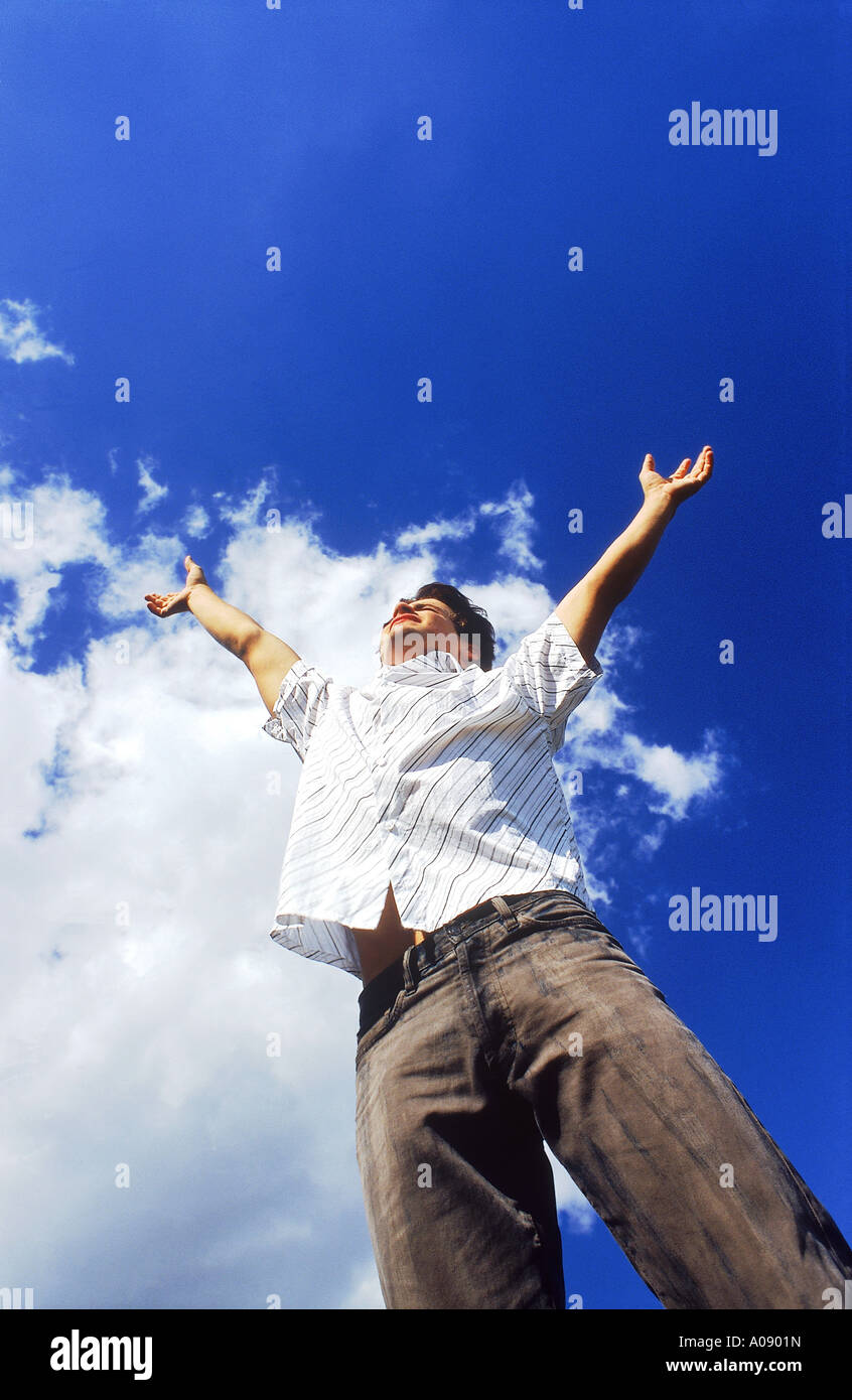 Young man jumping up in the air Stock Photo