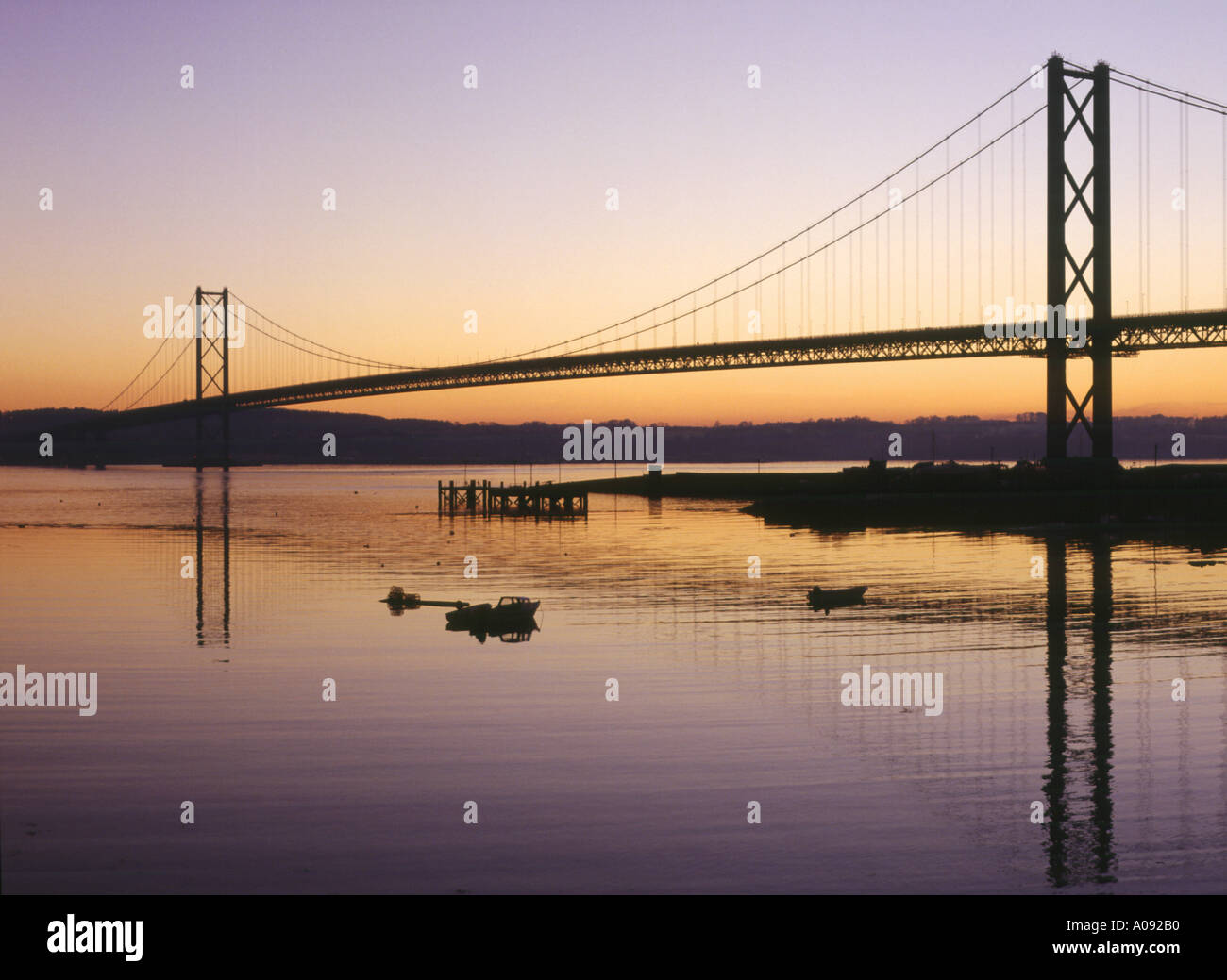 dh Forth Road Bridge NORTH QUEENSFERRY FIFE Scottish Cable suspension bridge across river forth at sunset scotland dusk Stock Photo