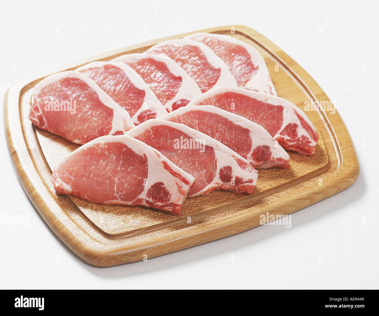 Uncooked Pork Chops On Cutting Board Stock Photo Alamy uncooked-pork-chops-on-cutting-board-stock-photo-alamy