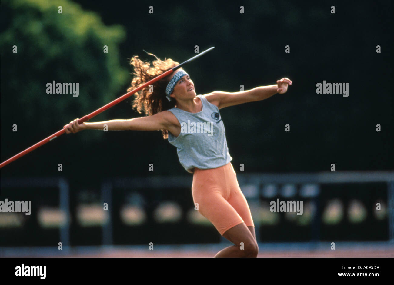 young woman throwing spear athletics Stock Photo Alamy