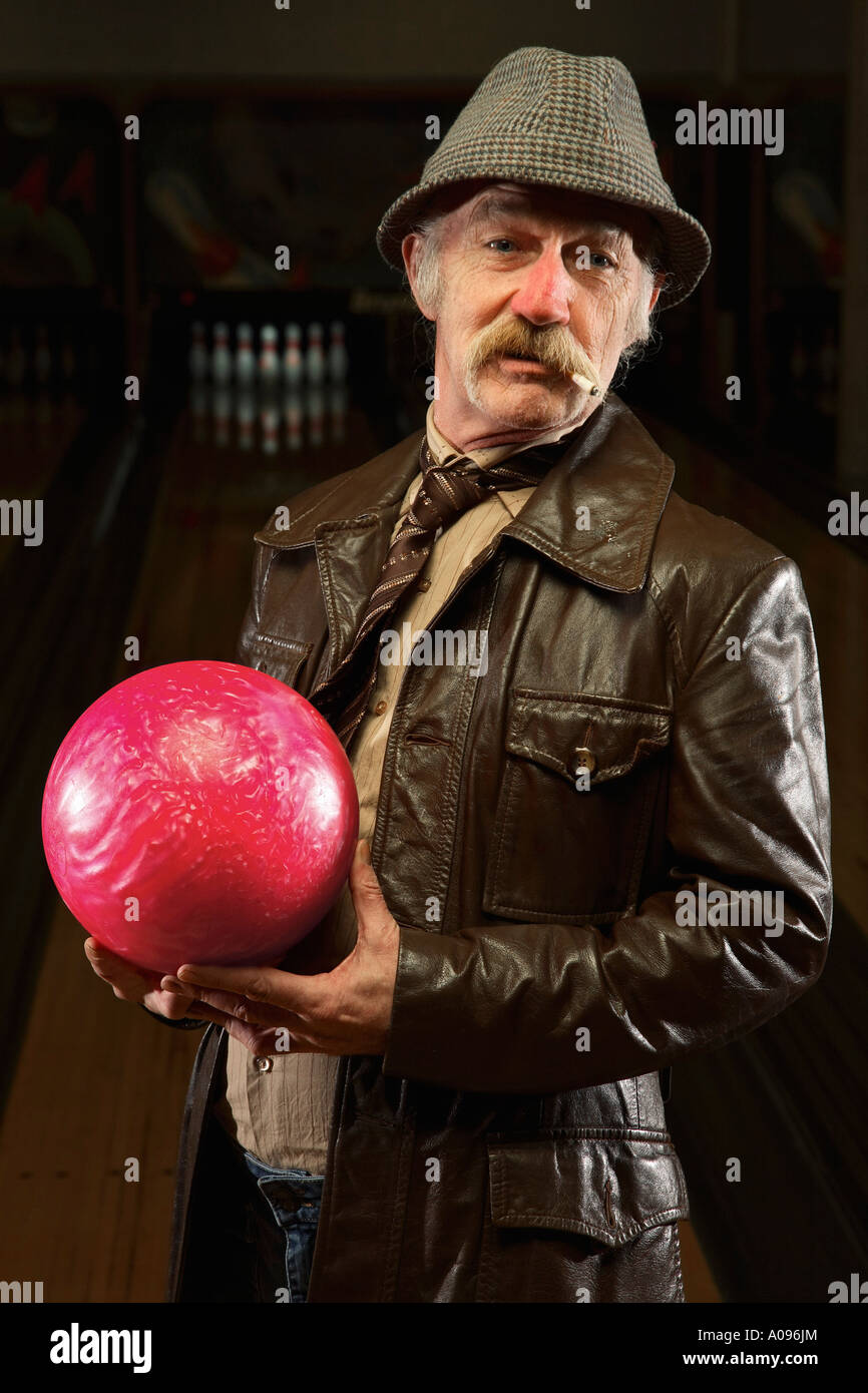 Man with Pink Bowling Ball Stock Photo