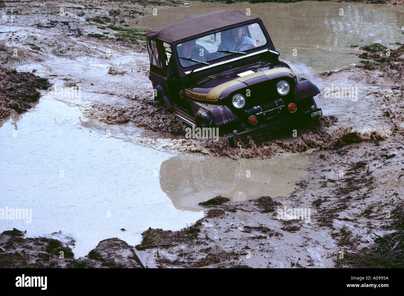 Jeep driving off road crossing mud and water wrangler jeep four wheel drice be stuck autocross