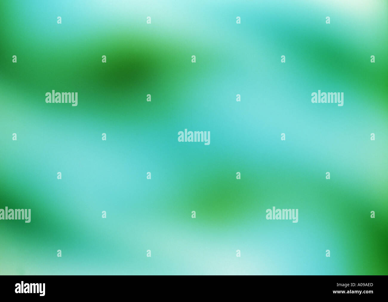 An abstract luminous light form of a wash of pastel blue and green ...