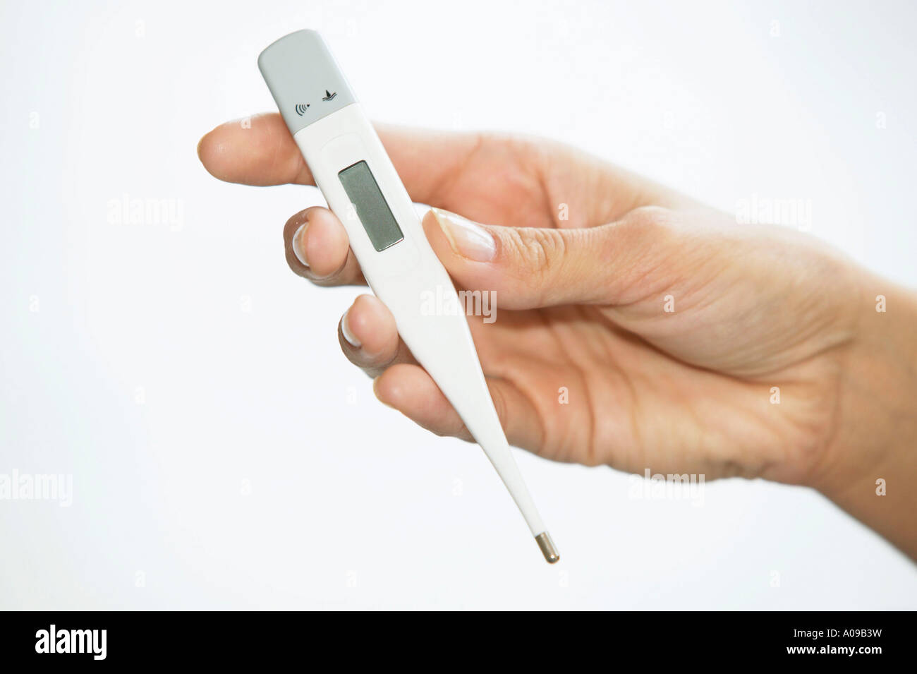 Hand mit Fieberthermometer, Erkaeltung, womans hand with clinical thermometer Stock Photo
