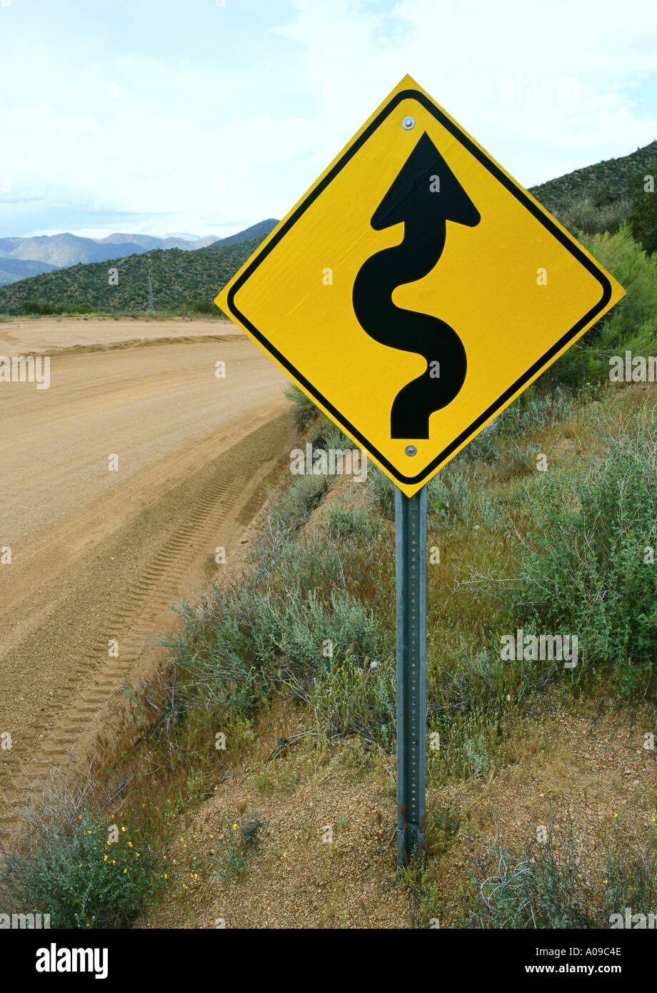 Winding road ahead warning sign Stock Photo Alamy