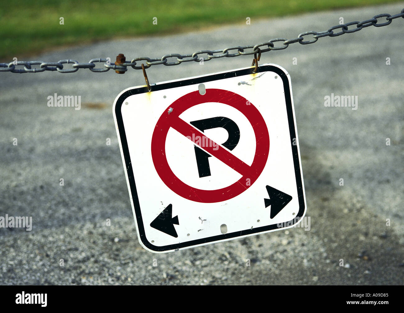 No parking sign hanging from a chain Stock Photo Alamy