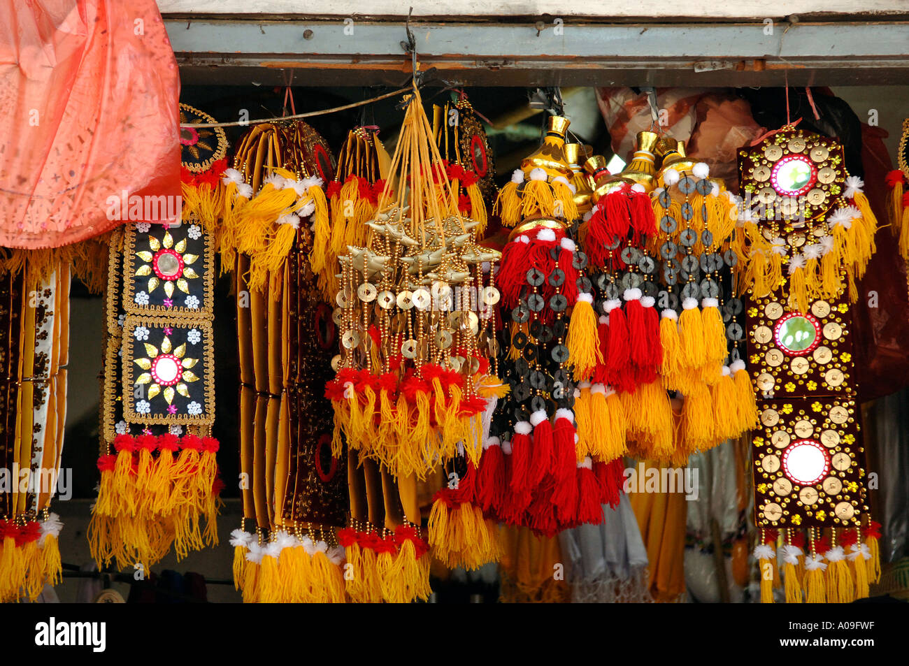 Red and yellow coloured Indonesian decorations and hanging art, Java