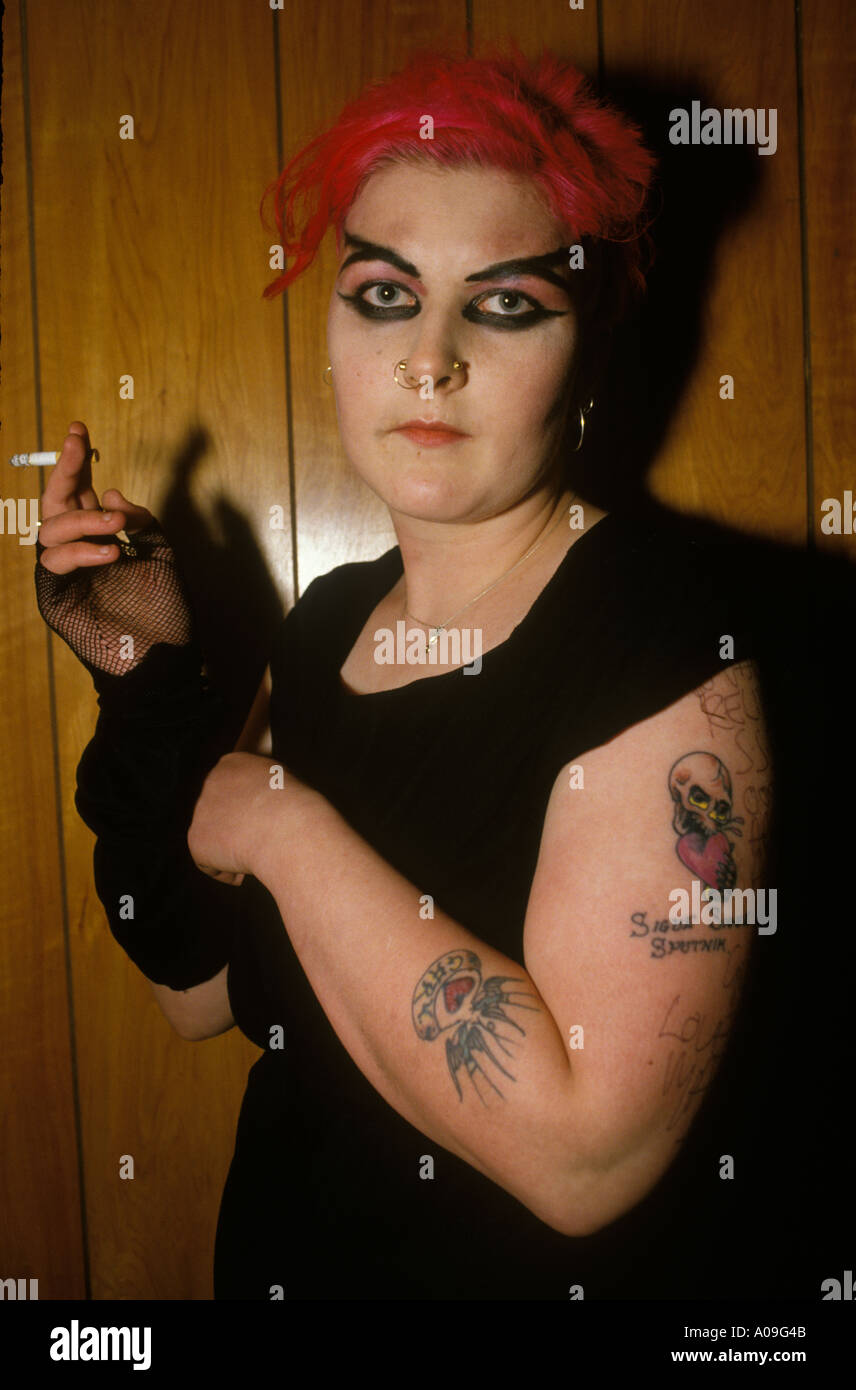 Punk girl with red hair and tattoo  at a Sigue Sigue Concert Newcastle upon Tyne  1986 HOMER SYKES Stock Photo