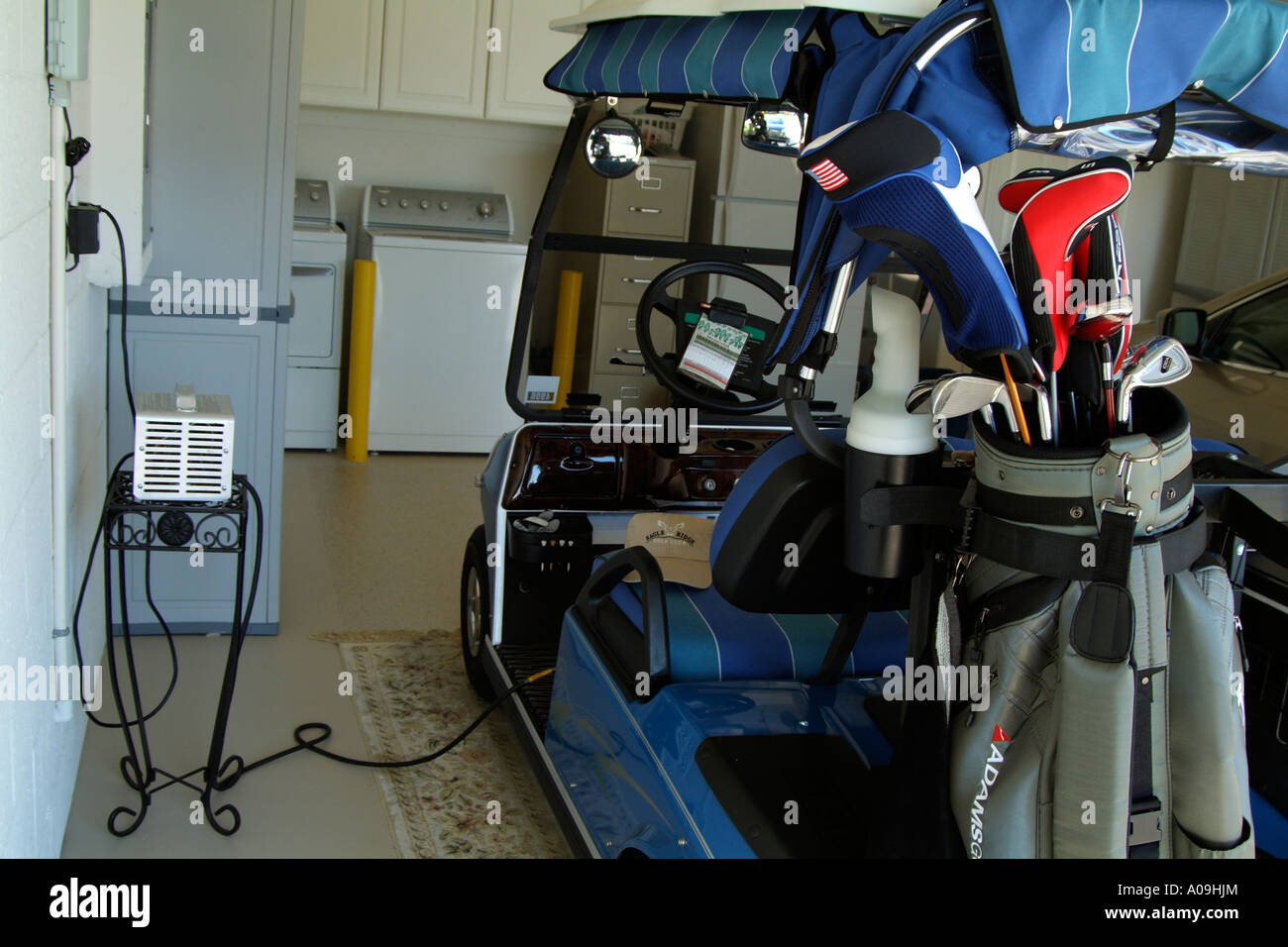 Electric golf cart in garage. Batteries being recharged Stock Photo Alamy