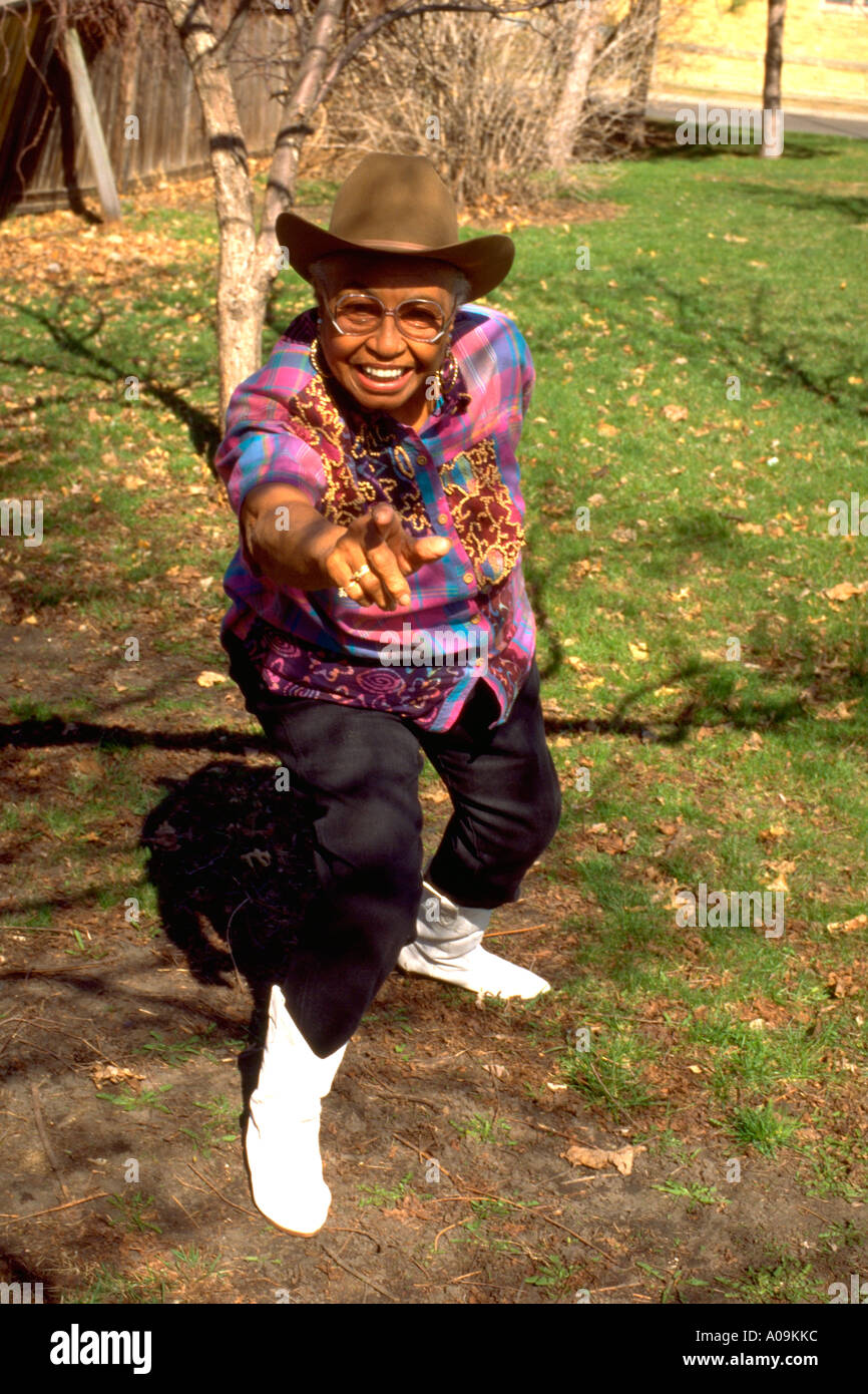 Mature Black African American cowgirl age 72 dressed up for inner city youth rodeo fundraiser. St Paul Minnesota USA Stock Photo