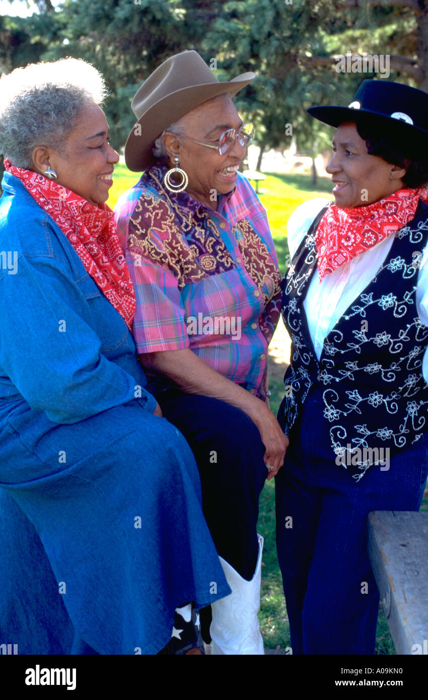 Mature Black African American cowgirls age 72 dressed up for inner city youth rodeo fundraiser. St Paul Minnesota USA Stock Photo
