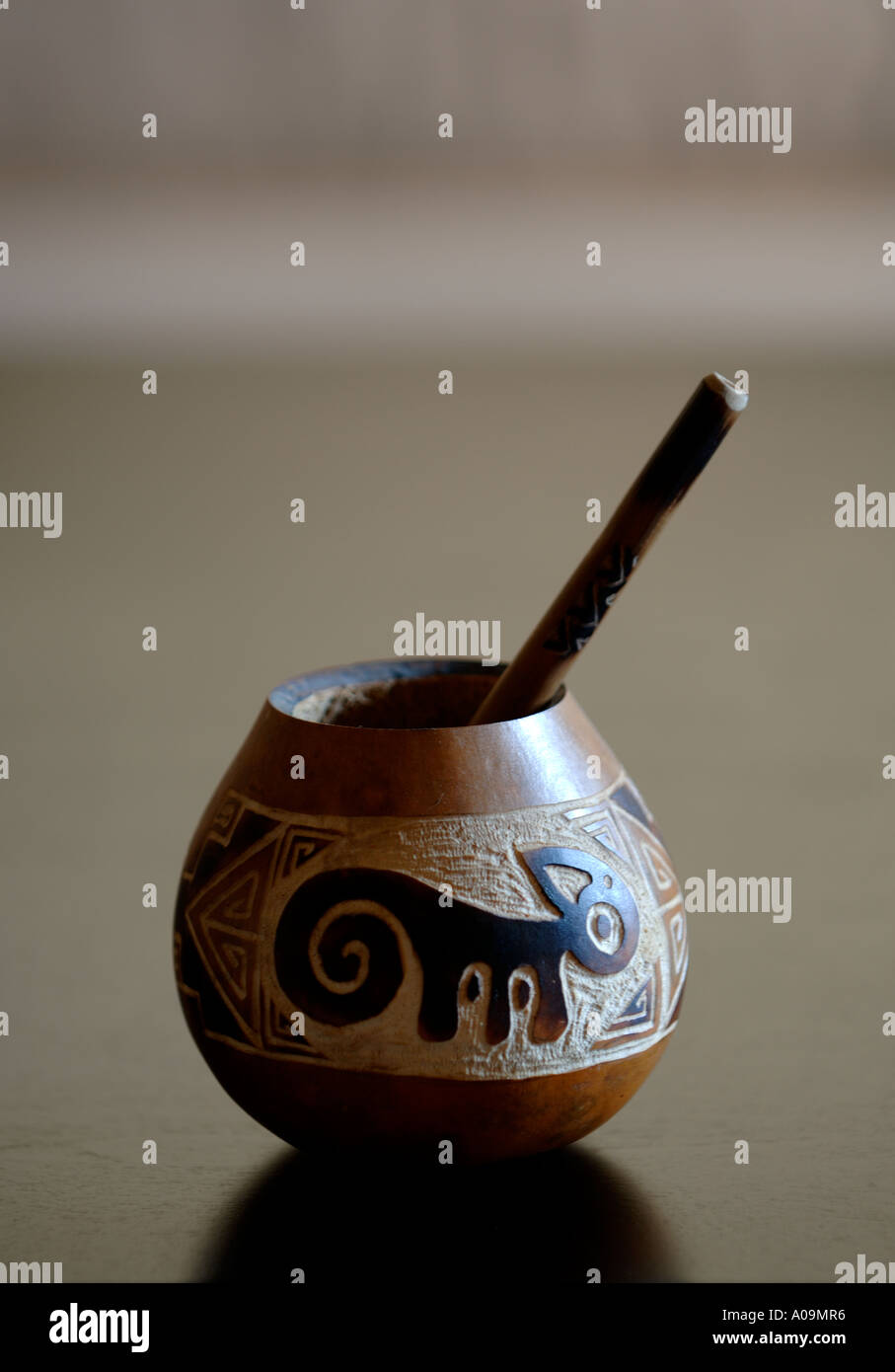 Handcrafted mate gourd and straw Stock Photo