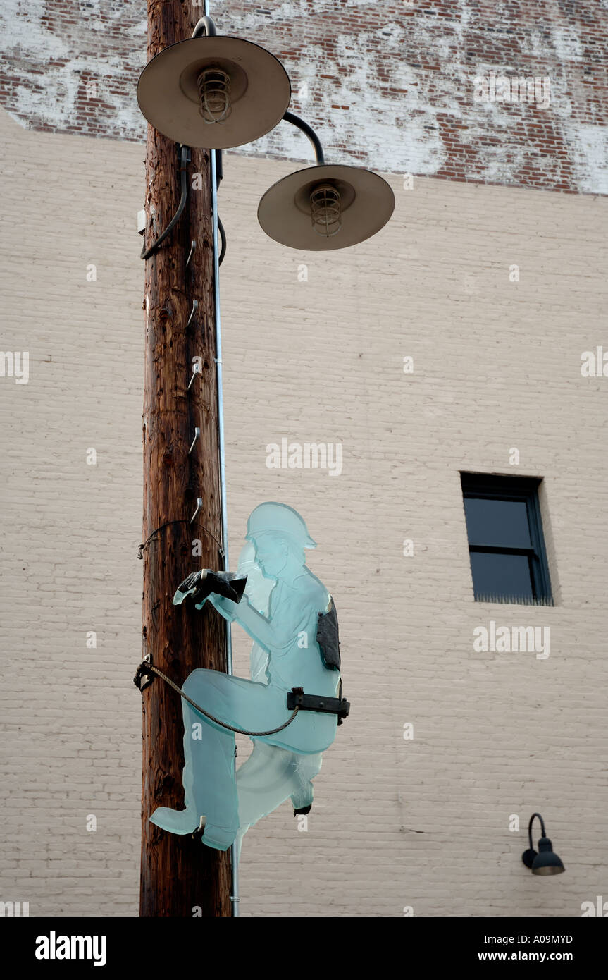 Communications worker going up a telephone pole Art in glass Stock Photo -  Alamy