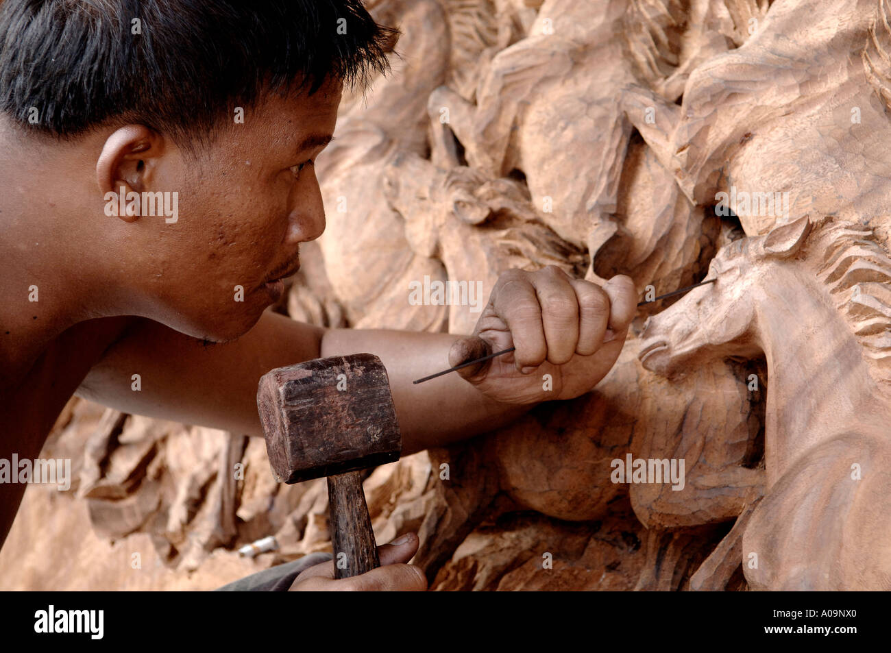 Craftsman carving complex wood carving, Ubud, Bali, Indonesia Stock