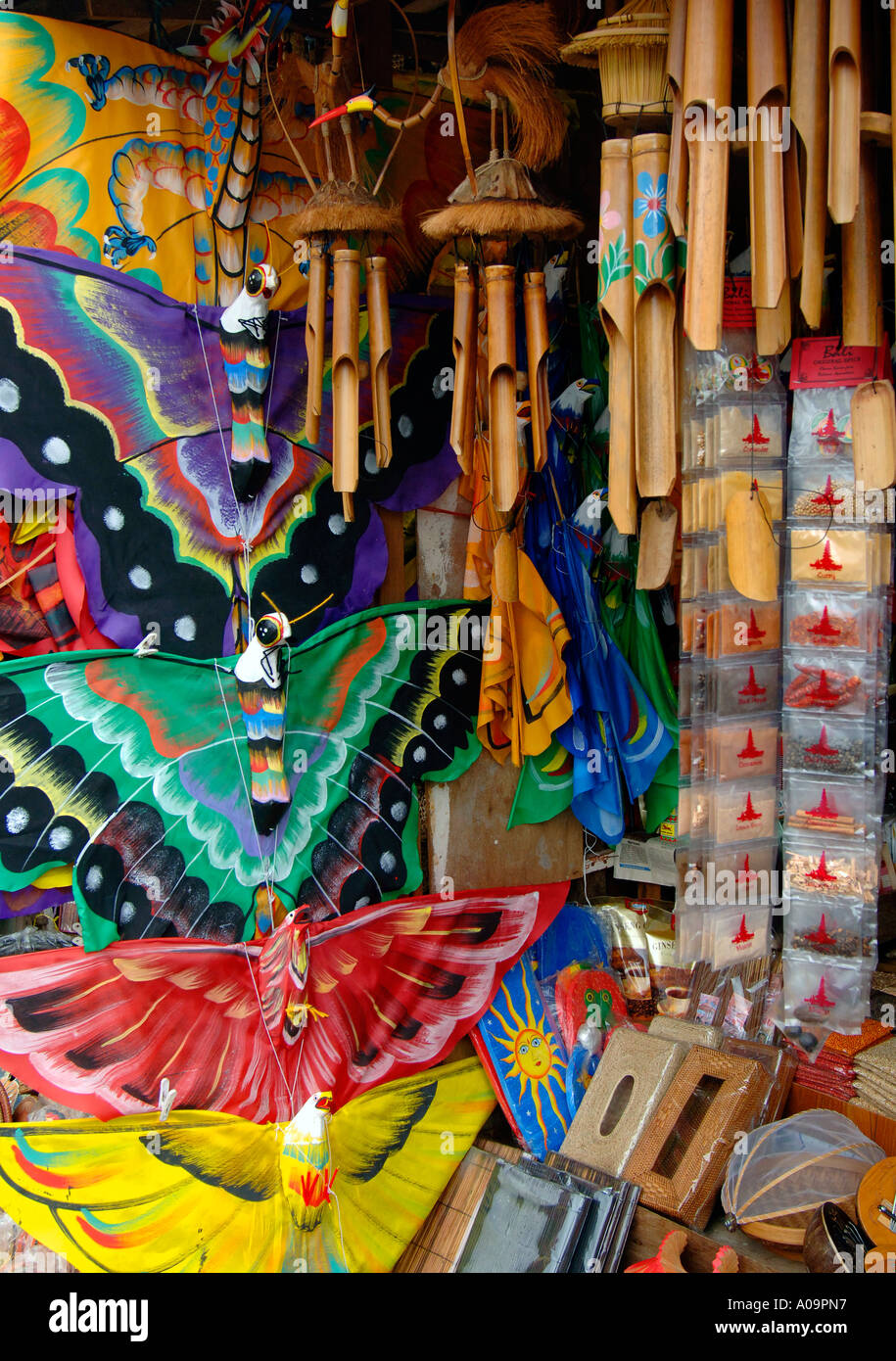 Brightly coloured kites and bamboo wind charms for sale, market stall