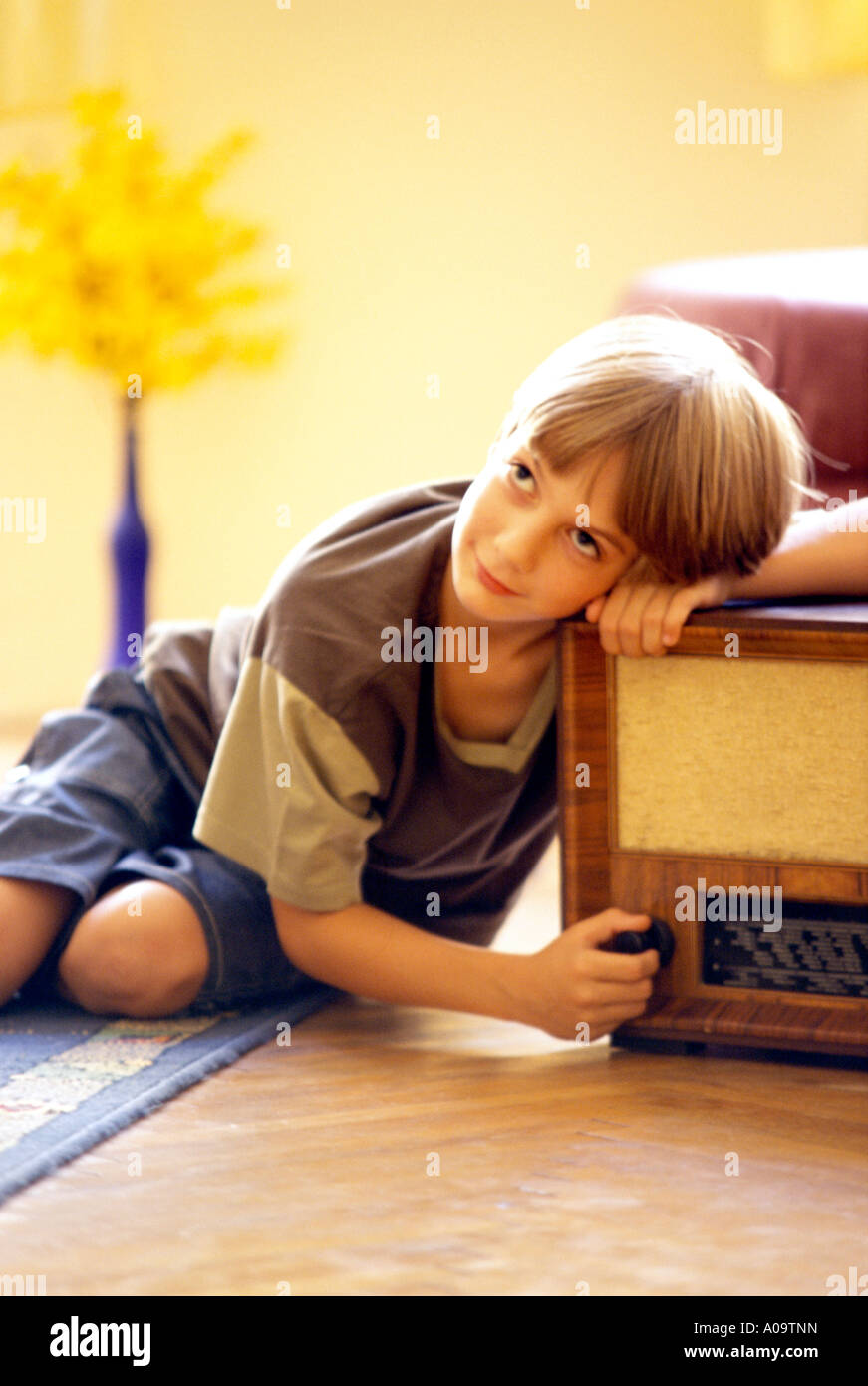 Junge hoert Radio, boy listening to radio Stock Photo