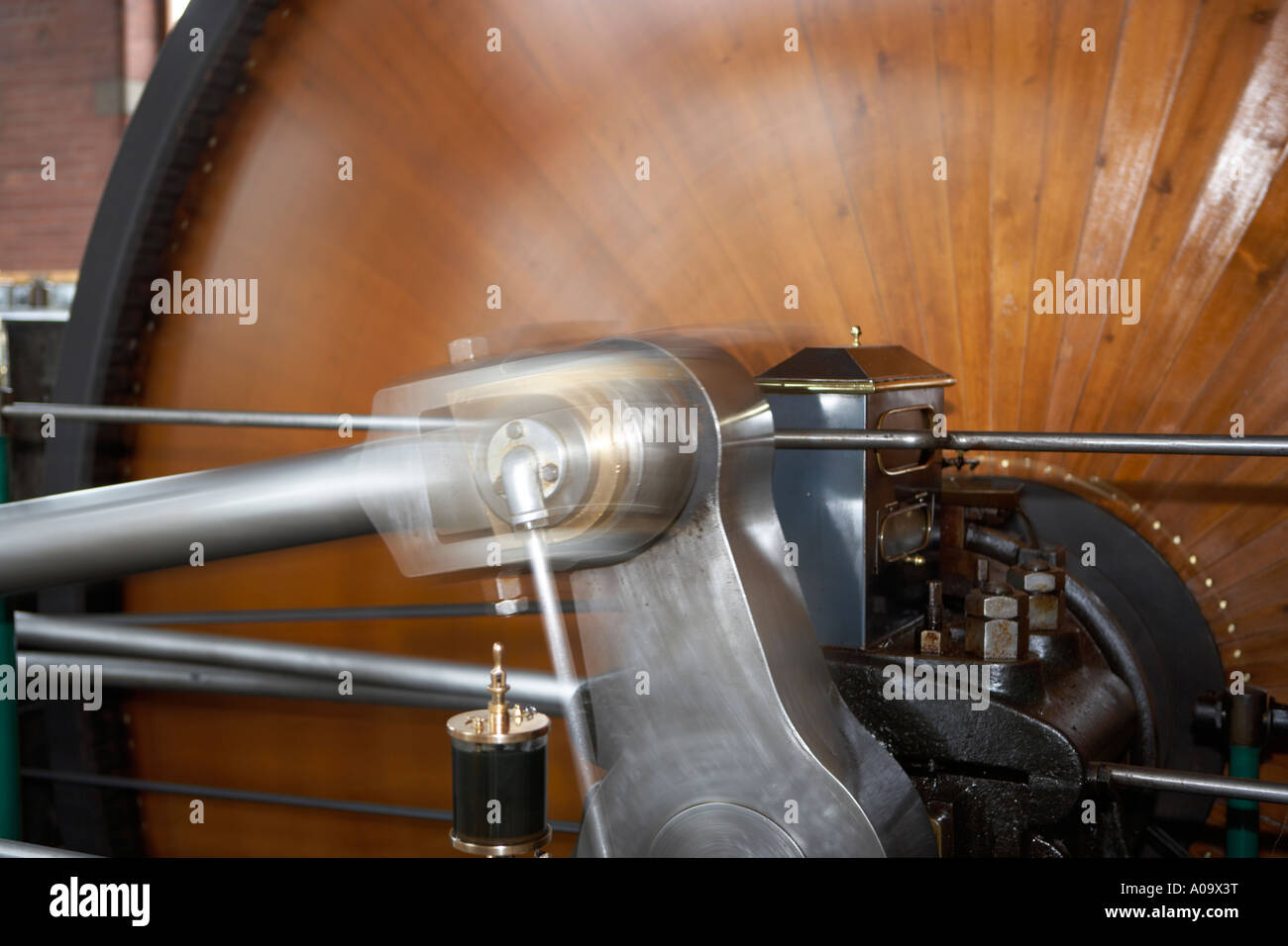 rotating flywheel and pistons on a restored steam engine Stock Photo