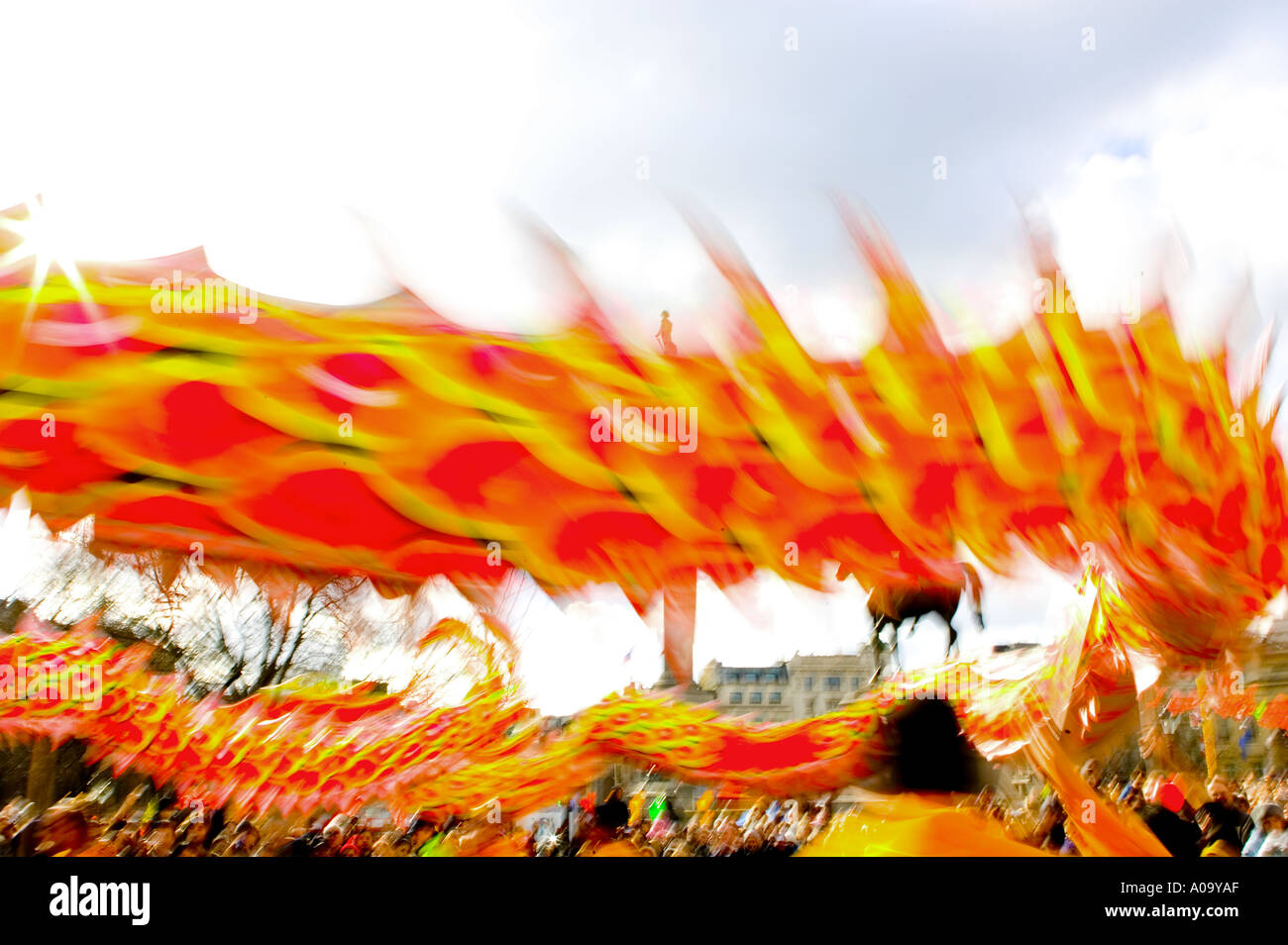 Movement blur image of orange Chinese dragon during Chinese New Year celebrations in Trafalgar Square London Stock Photo